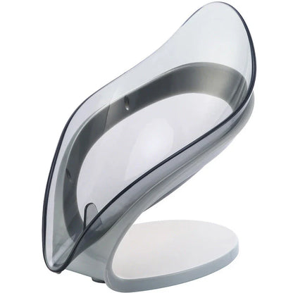 Elegant leaf-shaped soap dish with self-draining design and stable triangular shape, made of durable ABS material