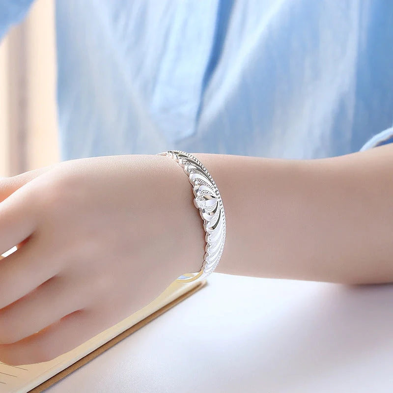 Women's silver electroplated crown bracelet with detailed design