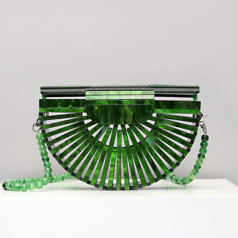 Stylish acrylic cross-body bag in various colors and strap designs, perfect for everyday use and fashion-forward British style.
