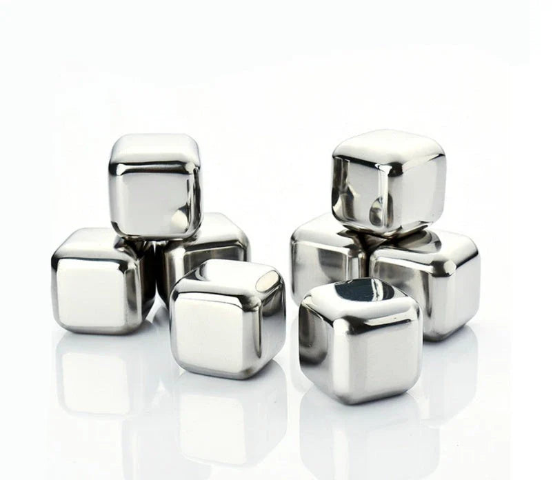 Premium stainless steel whisky chilling stones set in various shapes and sizes, including square, circular, heart, and diamond-shaped stones