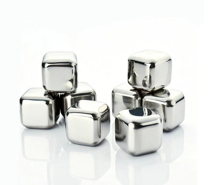 Premium stainless steel whisky chilling stones set in various shapes and sizes, including square, circular, heart, and diamond-shaped stones
