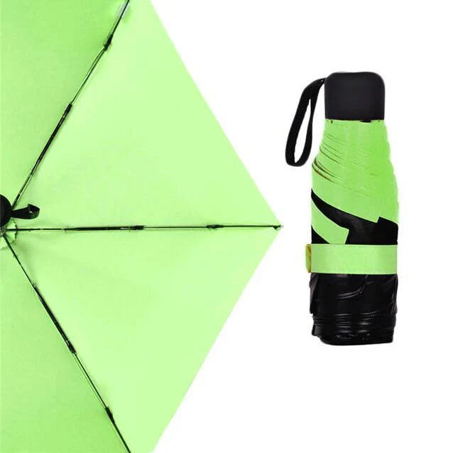 Compact folding umbrella in multiple colours, offering sun protection and windproof design for all-weather use in the UK