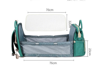 Portable folding crib and mummy bag in green and grey, compact design for baby travel