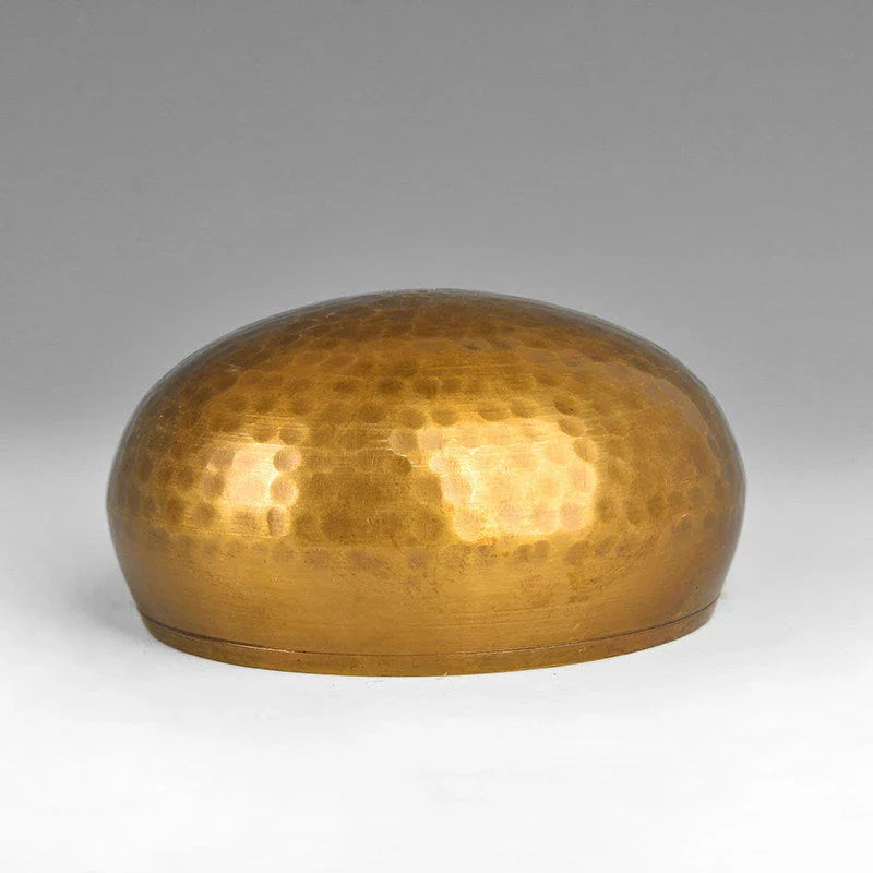 A handcrafted Tibetan singing bowl made of copper, used for meditation and relaxation.