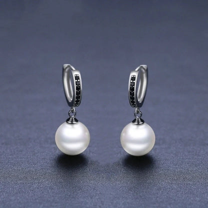 Trendy copper ball stud earrings with a minimalist design, showcasing a sleek and modern accessory for fashion-forward women