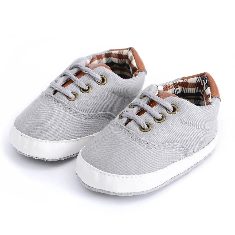 Solid colour baby canvas shoes with soft bottom and front strap in sizes 11cm to 13cm
