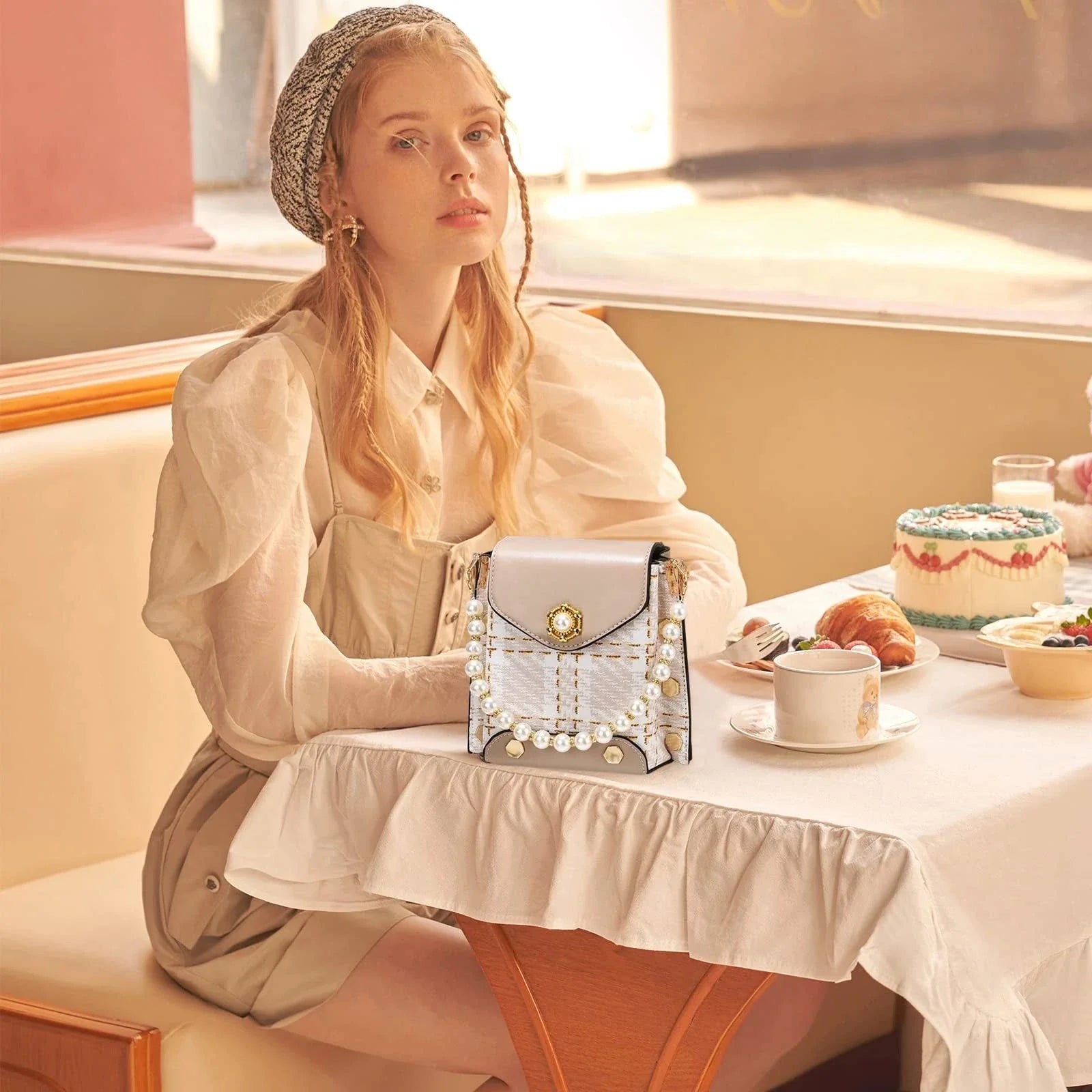 Premium crossbody phone bag with elegant pearl charm, made of durable PU leather and available in multiple color options