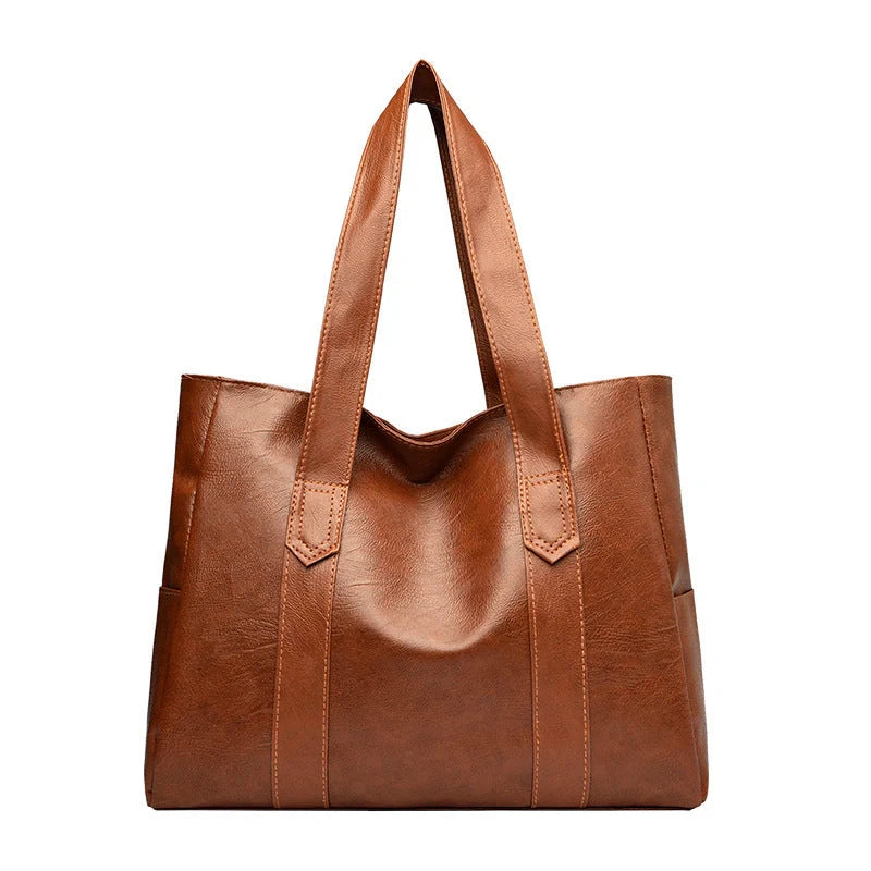 Stylish large capacity commuter shoulder bag in brown and black for autumn and winter