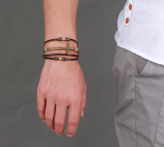 Rugged leather cross bracelet with durable construction and adjustable fit, a versatile accessory for the modern British gentleman