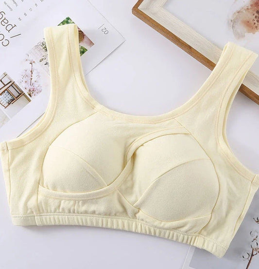 Supportive cotton sports bra with crossover design for lift and support, preventing sagging and bra lines