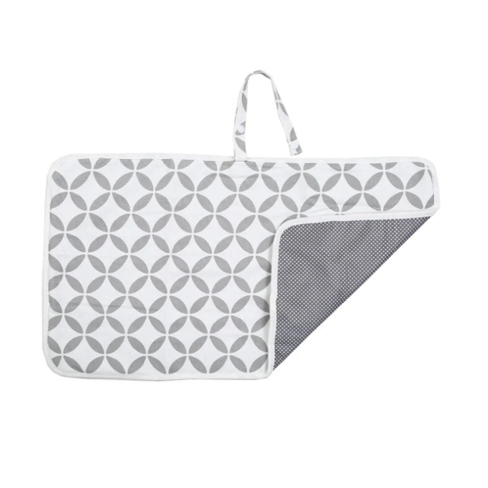 Portable diaper changing pad clutch with built-in toy ring, foldable design for easy transport