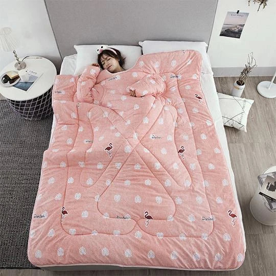 Cozy quilted lounger with sleeves in various colors and sizes, perfect for year-round indoor comfort and relaxation.