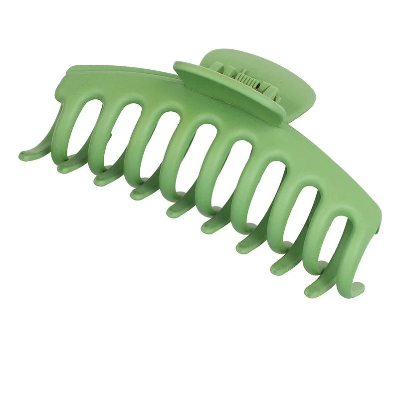 Candy-coloured plastic ponytail clip for showers and daily hair styling