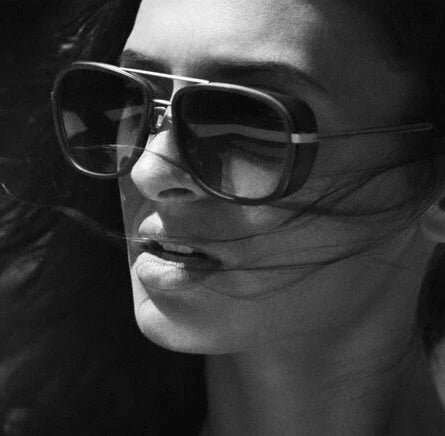 Stylish driving sunglasses with a retro-inspired design, durable metal and plastic frame, and advanced UV protection for all-weather driving and outdoor activities.