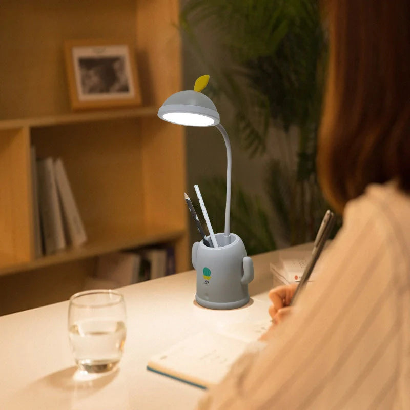 Cactus-shaped table lamp with pen holder and USB charging feature