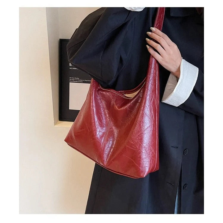 Elegant vintage designer women's shoulder bag in various colours