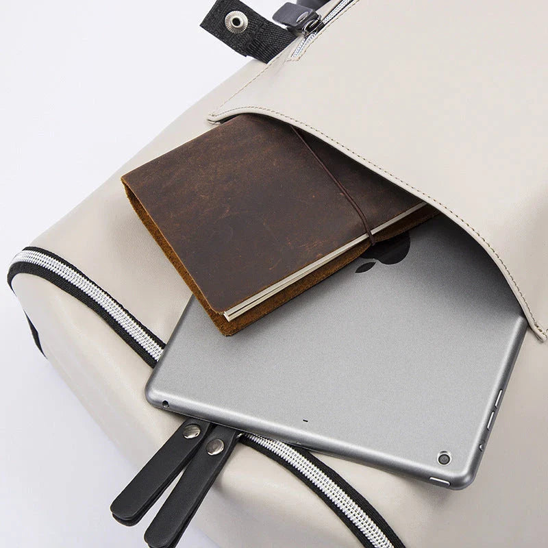 Premium PU leather backpack in black and white colours, featuring a spacious main compartment and multiple pockets for excellent organisation.