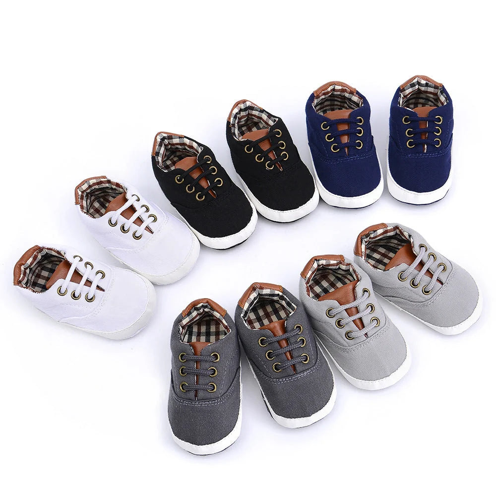 Solid colour baby canvas shoes with soft bottom and front strap in sizes 11cm to 13cm