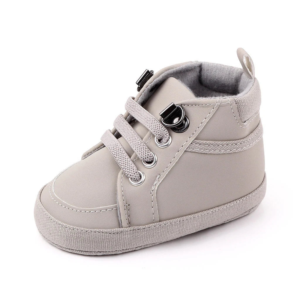 Soft-soled non-slip toddler shoes in brown, grey, and navy blue