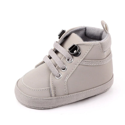 Soft-soled non-slip toddler shoes in brown, grey, and navy blue