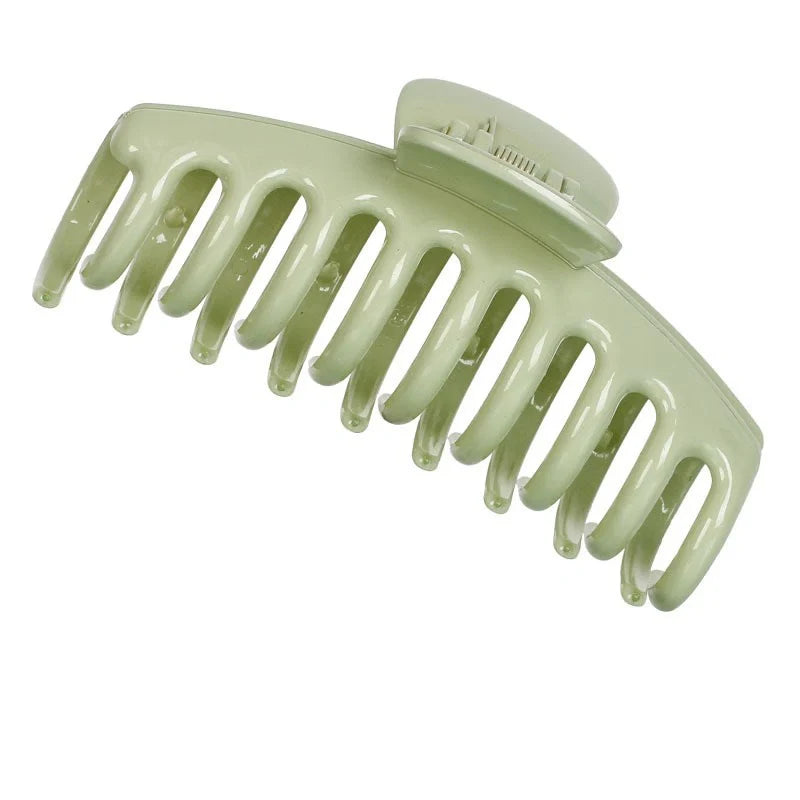Candy-coloured plastic ponytail clip for showers and daily hair styling