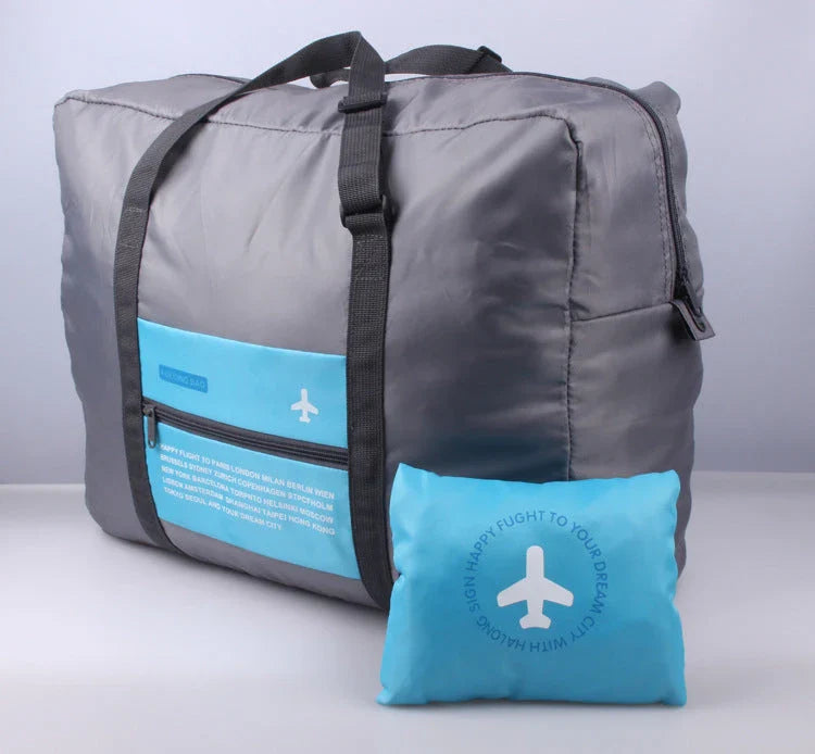 Foldable nylon travel holdall in various colours, including black, orange, green, and red