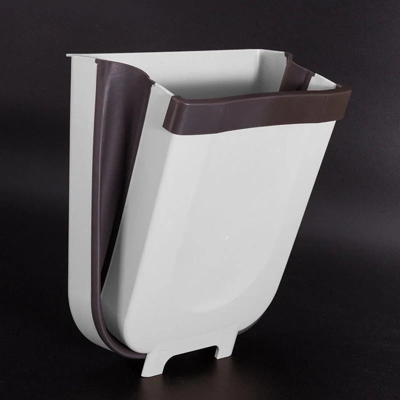 Foldable wall-mounted bin in brown and white colours, with a spacious 9-litre capacity and a sleek, space-saving design