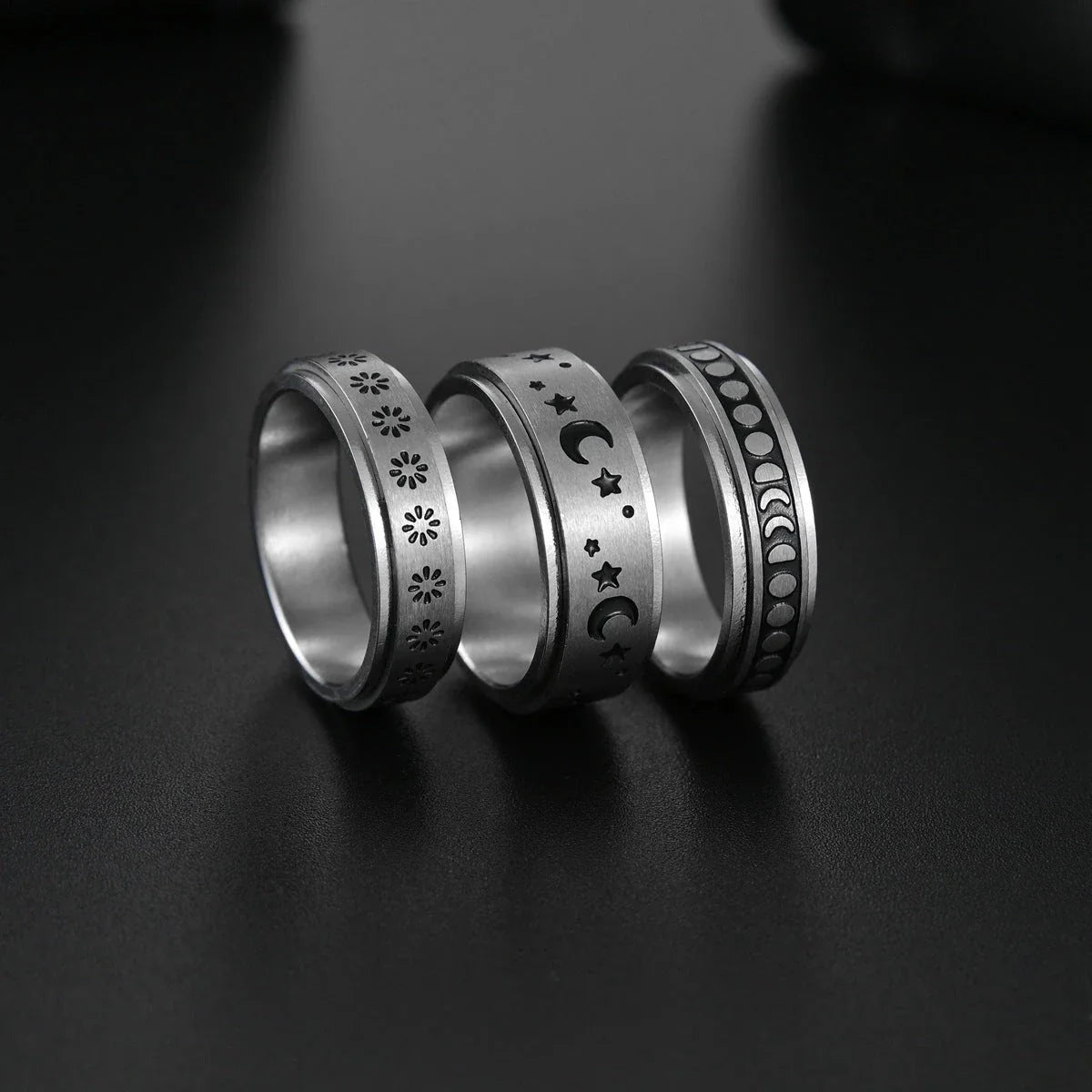 Titanium steel rings with captivating celestial designs including stars, moons, and floral motifs
