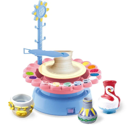 A blue electric pottery wheel kit with various clay and painting accessories for making unique pottery pieces