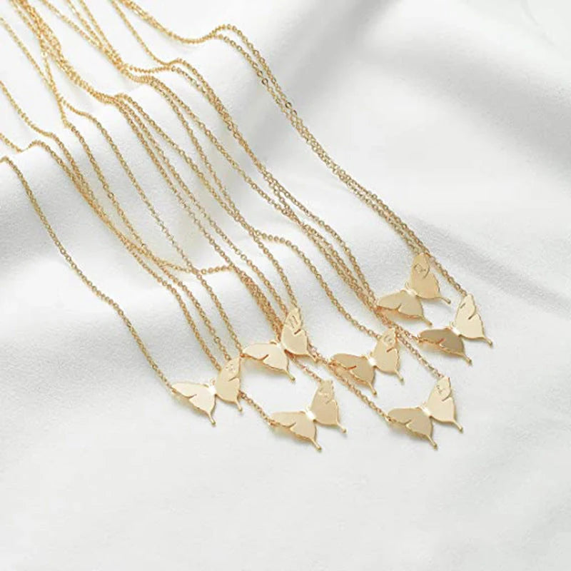 Elegant geometric butterfly pendant necklace in gold, silver, and rose gold