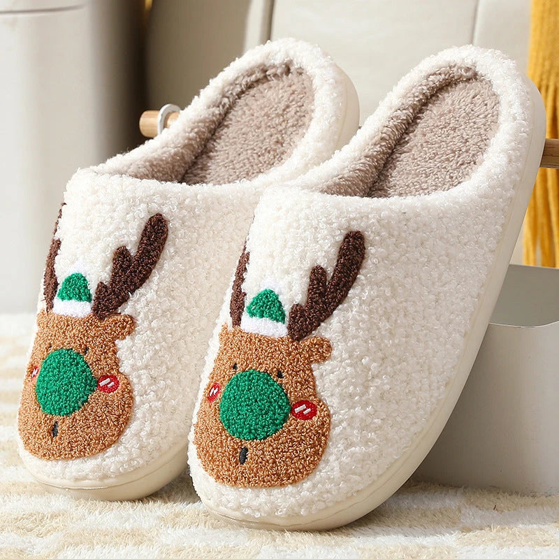 Cozy elk-themed slip-on house slippers in festive red and green colors with plush, soft materials for comfortable holiday relaxation