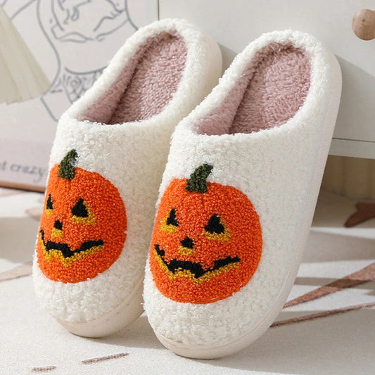 Cozy pumpkin-themed slippers with plush suede upper and non-slip rubber sole for indoor comfort