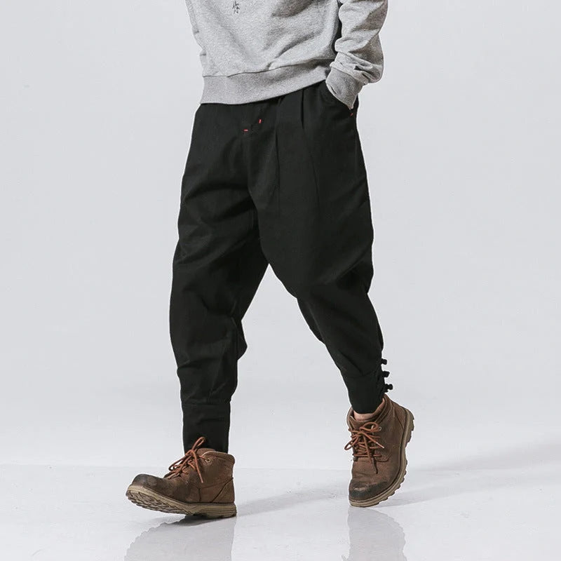Men's cotton blend casual trousers with button placket in black, blue, and grey