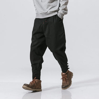 Men's cotton blend casual trousers with button placket in black, blue, and grey