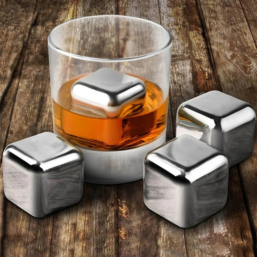 Premium stainless steel whisky chilling stones set in various shapes and sizes, including square, circular, heart, and diamond-shaped stones