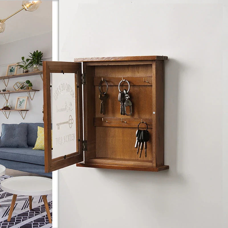 Vintage-style wooden key cabinet with six hanging hooks, offering a compact and stylish storage solution for your keys and small items.
