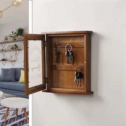 Vintage-style wooden key cabinet with six hanging hooks, offering a compact and stylish storage solution for your keys and small items.