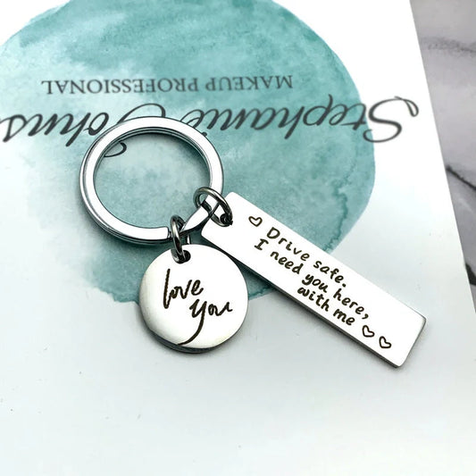 Unisex stainless steel safe driving keychain with elegant lettering
