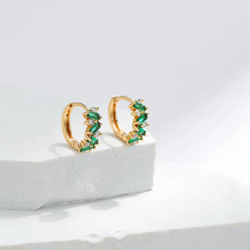 Elegant leaf-patterned ear clips with zircon and emerald gemstones, crafted in premium 18-carat gold-plated copper