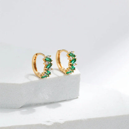 Elegant leaf-patterned ear clips with zircon and emerald gemstones, crafted in premium 18-carat gold-plated copper