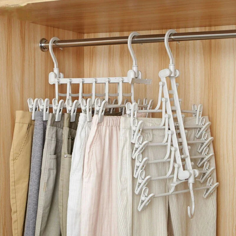 A white plastic hanging rack designed to maximise closet storage space by allowing users to vertically stack their clothes and accessories.