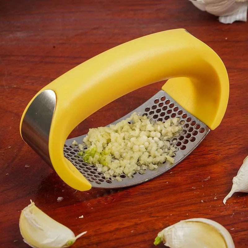 Stainless steel garlic press with ergonomic handle for easy mashing