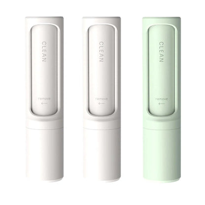 Rotating cylinder electrostatic pet hair remover brush in white, blue, green, and pink