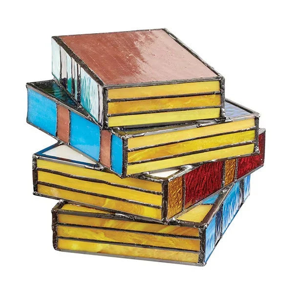 Elegant stacked book lamp with warm, ambient lighting for a cozy reading nook