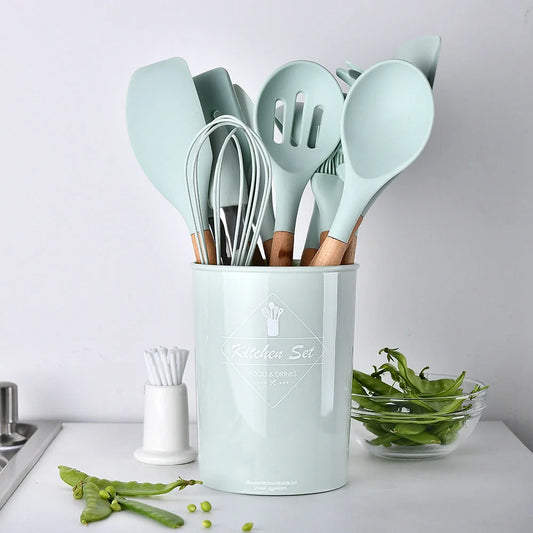 Silicone kitchenware set with wooden handles in various colors and styles, perfect for cooking, baking, and serving