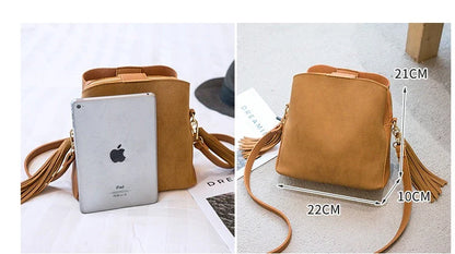 Trendy frosted tassel bucket bag in a range of classic colors, featuring a spacious interior and a dedicated camera pocket for maximum convenience.