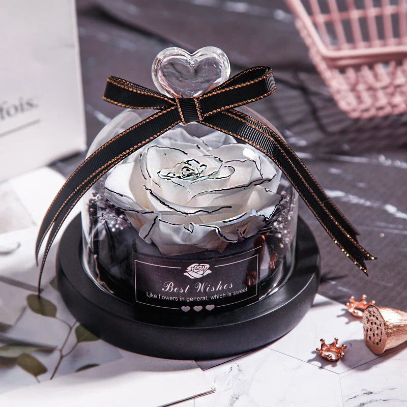 Enchanting Eternal Rose with LED lighting in a glass display, showcasing its timeless beauty and elegant design