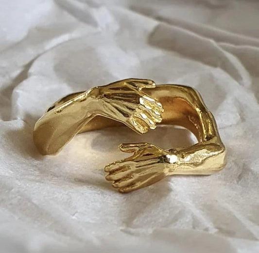 Elegant Adjustable Love Hands Embracing Ring in gold and silver, a perfect symbol of affection