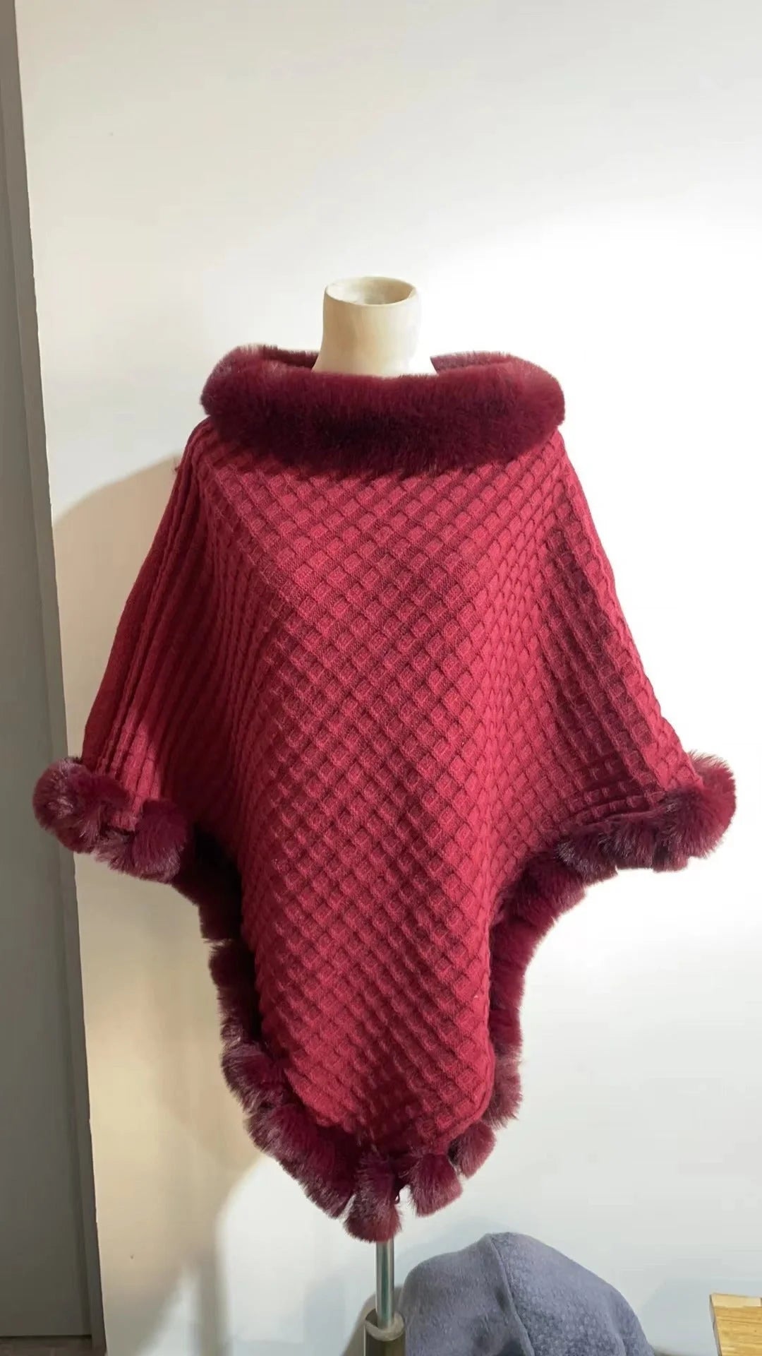 Luxurious rabbit fur wrap shawl in various colours, featuring a soft, cosy collar and a flattering cropped fit for a chic, polished look.