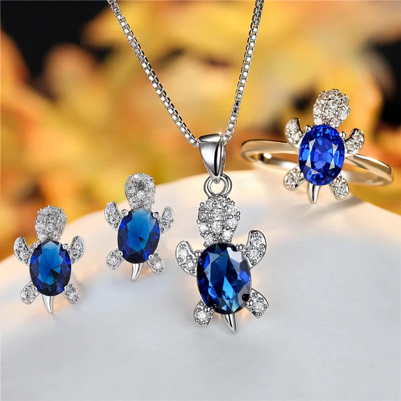 Stylish turtle pendant necklace with vibrant rainbow stones, perfect for women and children.